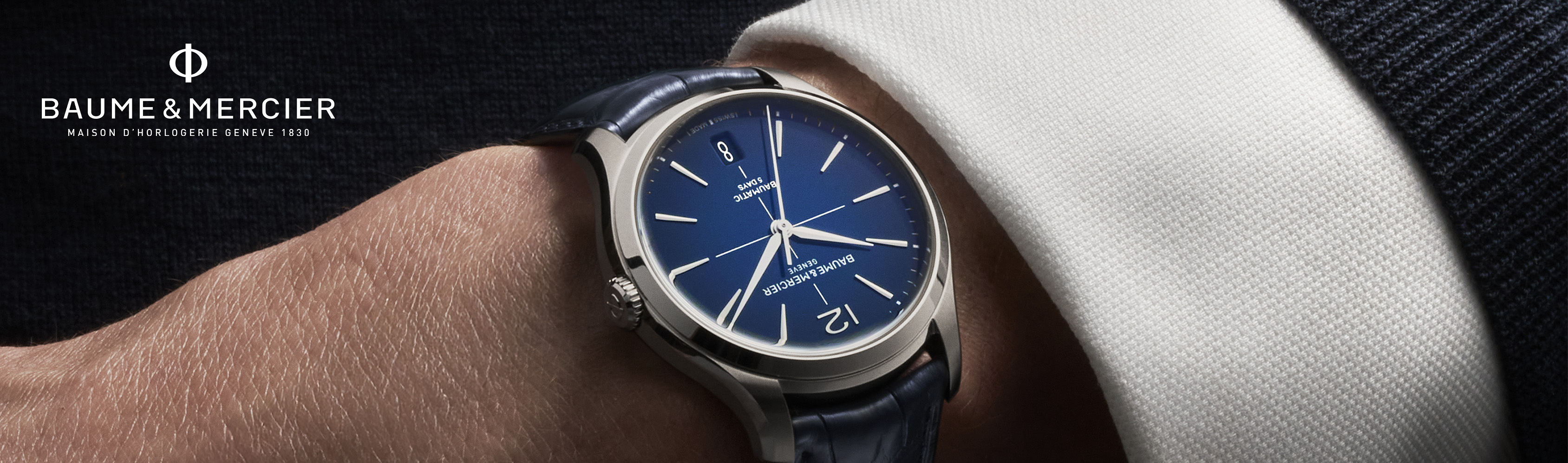 Baume & Mercier watch on a wrist with a blurred background